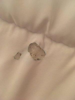 Cigarette burns on bed