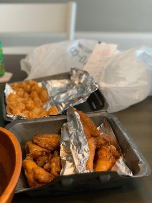 10 piece wings with tots! Spicy lemon pepper (left) and spicy garlic Parmesan (right)