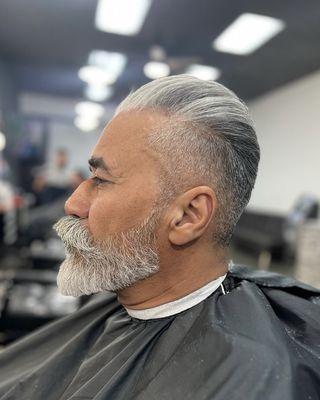 Client's haircut, hair styling, and beard shaping