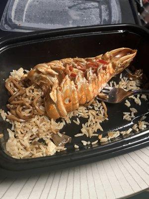 Lobster on the mayflower, with half eaten shrimp and House Fried Rice and Lobster Tail and Shrimp Combo