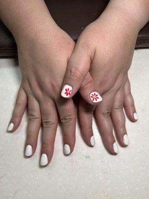 Gel nails with nail art.