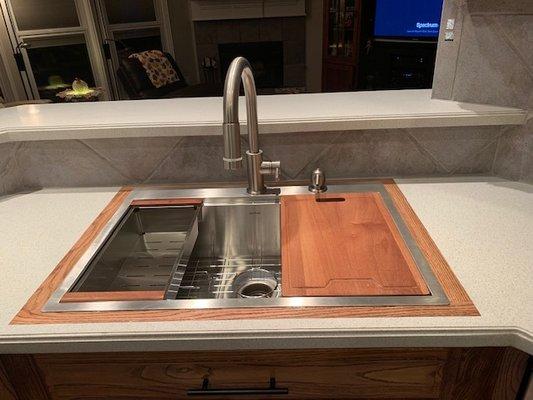 New stainless farm sink with oak trim designed by Trey--pretty classy!