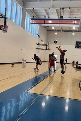 Basketball training at the gym.