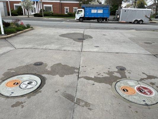 Evidence of water being removed and dumped in sewer next to tanks