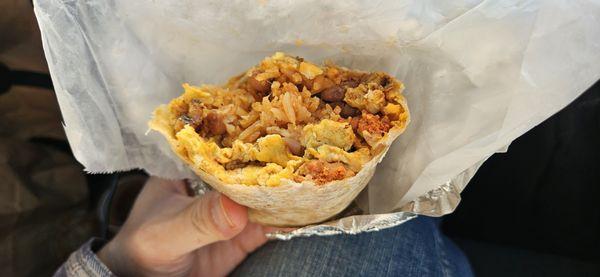 Breakfast Burrito (inside exposed). I got mine with chorizo. It was filling.