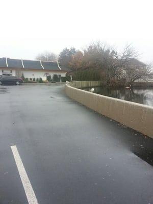 Lake connected to parking lot on the right side