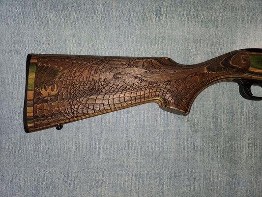 Carved stock with alligator