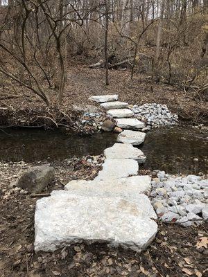 New stones placed to cross the creek with minimal re-routing of the trail.