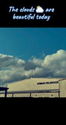 A picture of the clouds over the gymnasium and cafeteria