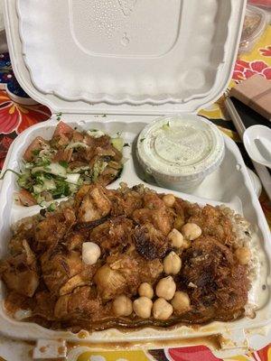 Bowl with butter chicken and bulgar