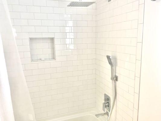 All New: tub, tile wall, tile floor, hardware