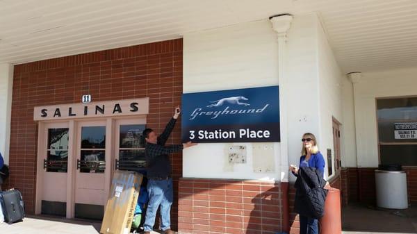 The New Greyhound sign in front of the Train Station