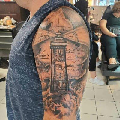 Lighthouse tattoo by artist Jose Manuel