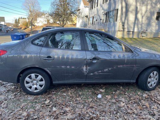 This is what the car looked like before Laszlo, the whole side of the car is damaged, door handle and mirror are ripped off