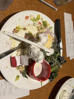 We've paid our bill and the dirty plates are still here.