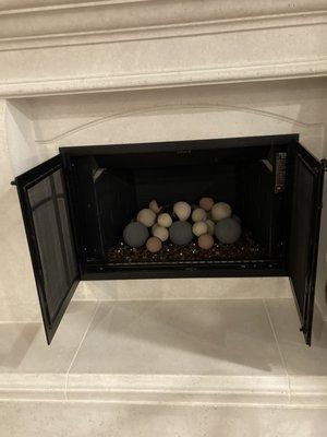 Fireplace installed with H burner, fireglass and fireball...