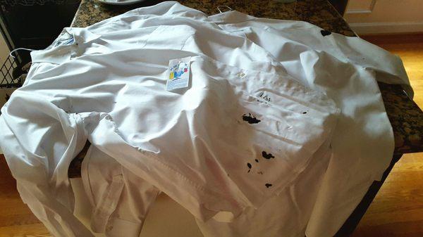 Ink stain on dress shirts when returned.