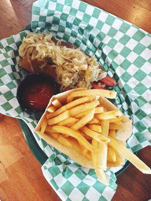 All beef kraut hot dog with a side of fries.