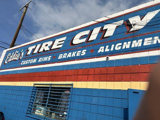 Eddie's Tire City with the heavens above open for business.