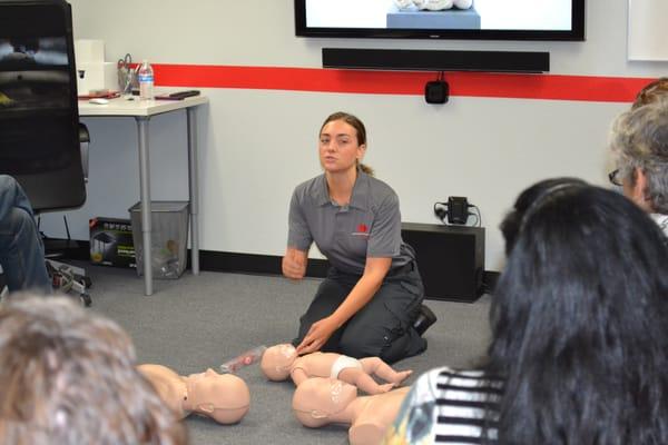 AH+RT Instructor Taneka teaching Adult/Infant CPR, AED & First Aid to the teachers of  Archbishop Howard.