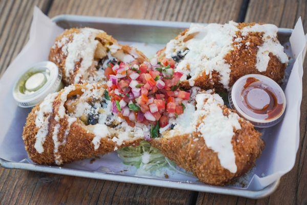 CHIMIS * chipotle chicken, cheese, black beans, jalapeños & corn, wrapped in a deep fried flour tortilla