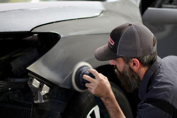 One of our painters prepping a fender for paint!