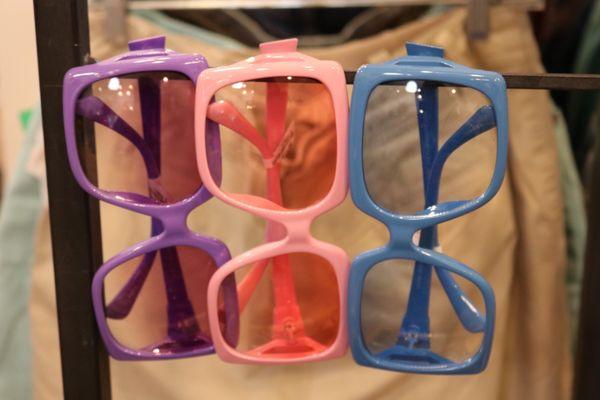 Purple, pink and blue sunglasses.