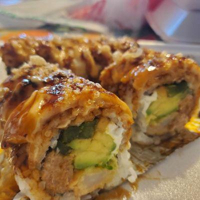 Mimi's Fire Roll: Baked White Tuna on top. Inside jalapeño  (cut up no seeds), cream cheese, Tuna, avacado, tempura shrimp.