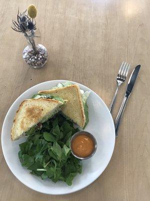 Chicken Salad sandwich on sourdough with greens and house dressing