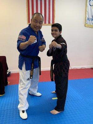 Master Lee and Arsham after his Black Belt Exam