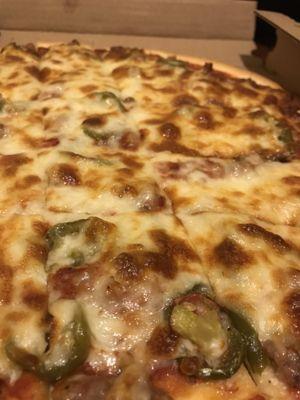 Sausage and jalapeño thin crust pizza