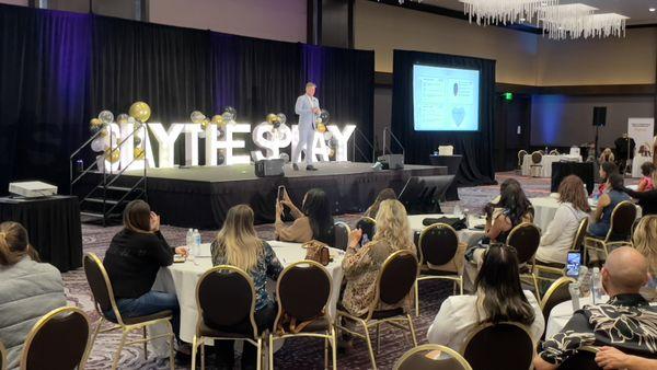 Jimmy Coco of Sunless Tanning speaking at 2023 Slay the Spray Event held at the Hilton LAX hotel in Los Angeles, CA.