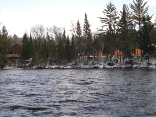 Riverview Lodge and cabins from the river upstream.