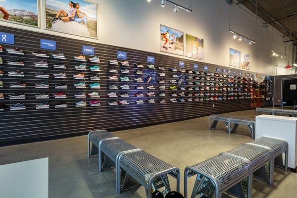 Shoe wall with top brands such as Hoka, Saucony, Asics, Brooks and more