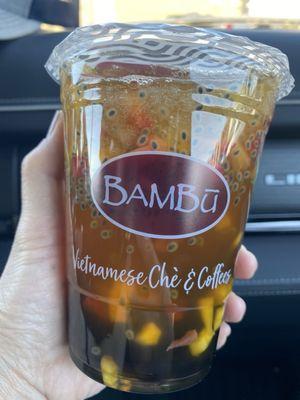 Mango Fruit Tea - light ice, half sweet, with basil seeds, mango chunks and boba.