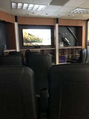 Cool theater like set up in lounge - appear to be van seats.