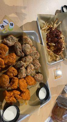 Medium and Parmesan Garlic boneless wings with chili con queso fries