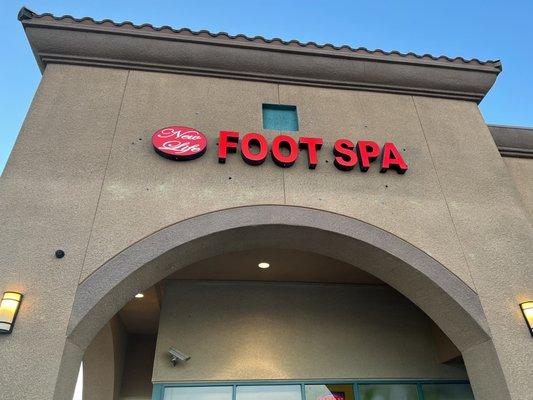 New Life Foot Spa signage on the building.