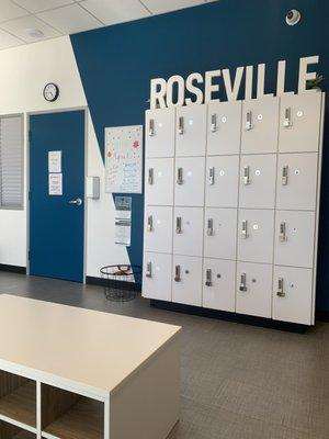 Shoe cubbies, lockers for personal belongings, & information board.