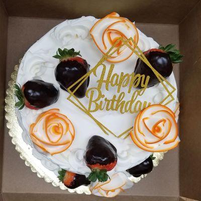 Birthday cake with chocolate covered strawberries