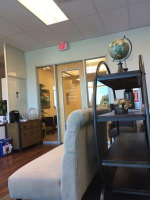 Comfy patient waiting area, accompanied with a Keurig machine for refreshments