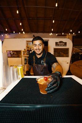 Alejandro serving the best old fashioned.