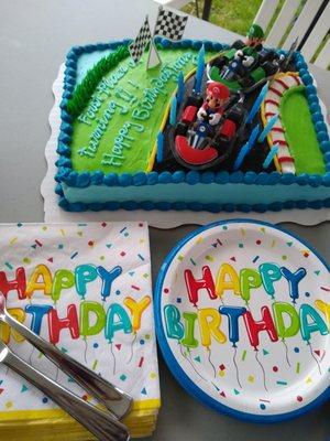 This Walmart does great, affordable cakes!! Easy to order and pay online, too!! My now-11 year old loved his Mario Cart cake!!