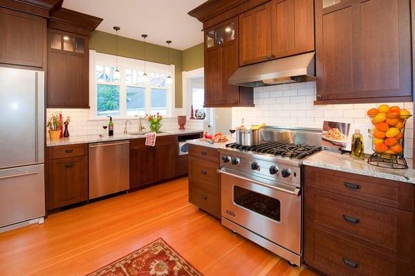 This refreshing new kitchen, integrates seamlessly into the old space.