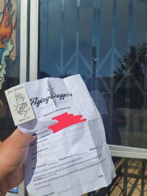 No one in shop. Bars blocking door. Signed appointment sheet with business card.