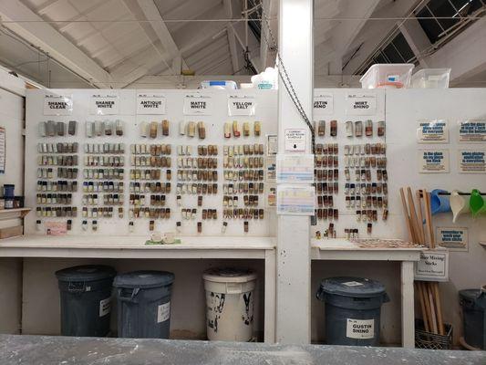 Part of the Glaze Room, with samples on the wall