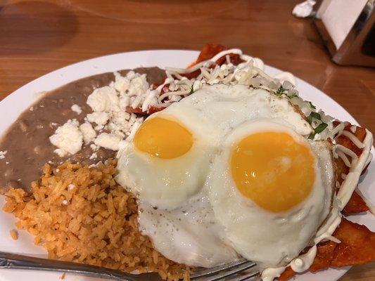 Chilaquiles and eggs with rice and beans