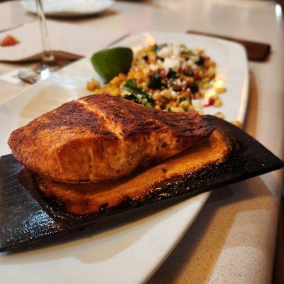 Cedar Plank Salmon with white corn & spinach succotash topped with Feta.