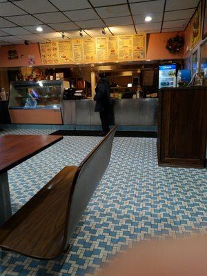 Counter at funny greek. We normally get mini gyro, salad, lemon chicken orzo soup or fried.