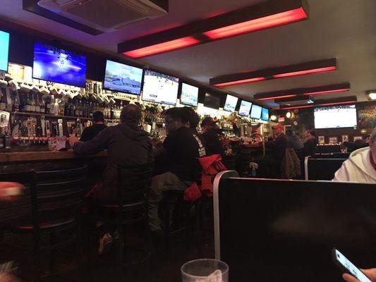 Interior - Bar with about a dozen different TV monitors all watching different sporting events